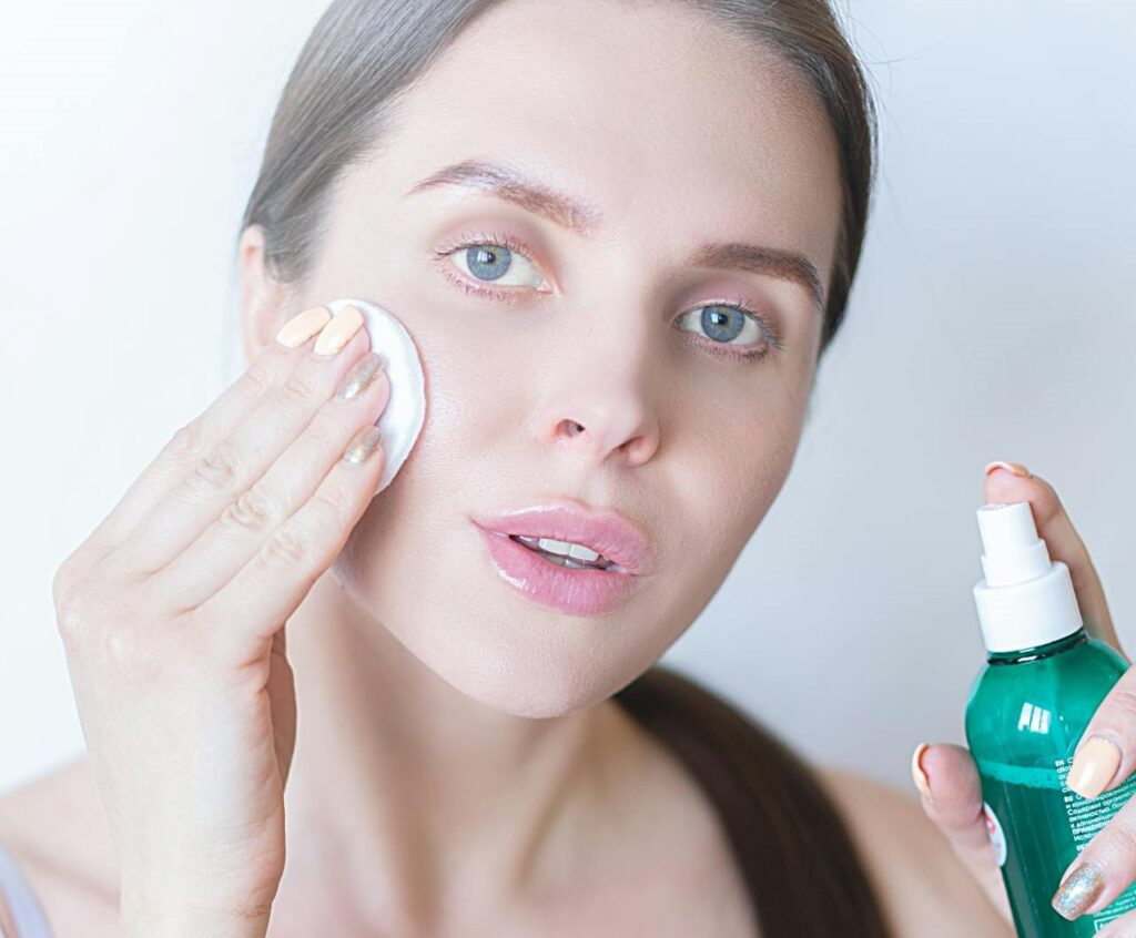 Women using pad while using facial toner