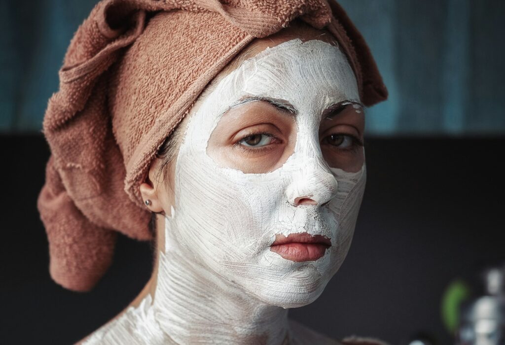 white facial cleanser applied on the face of a women