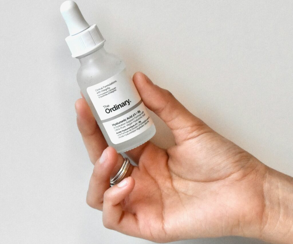 women holding the ordinary serum