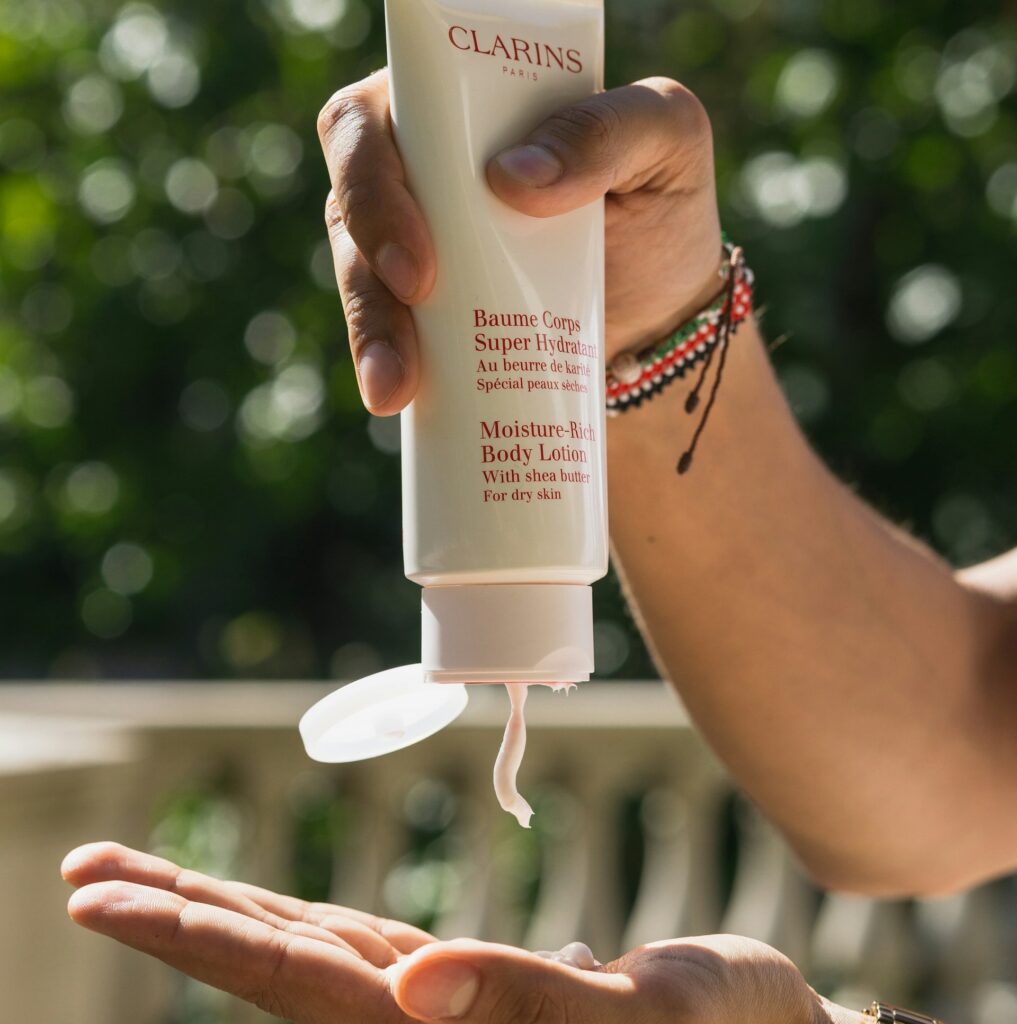 Moisturizer being applied as the final step before sunscreen, following the correct order for skincare to lock in moisture.