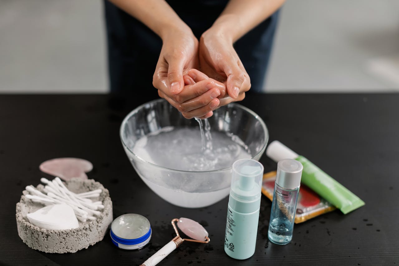 Teenage girl washing her face with a foam cleanser